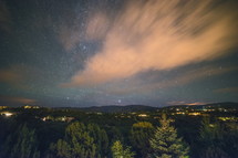 Timelapse at Night Over Santa Fe New Mexico with Moon Rising. High quality FullHD footage