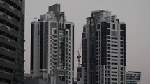 Buildings and skyscrapers in downtown Dubai in cinematic slow motion.