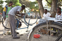 man fixing a bicycle in Ethiopia 
