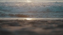 Slow-motion shot of waves at the beach during beautiful sunset in Mexico	