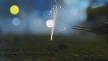Lighting a firecracker with following explosion