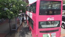 BELFAST, UK - CIRCA JUNE 2018: Double decker bus at bus stop, leaving after boarding people - EDITORIAL USE ONLY