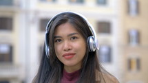 confident young woman wearing headphones 