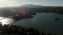 Aerial View Of Lake Izabal (Golfo Dulce) On A Sunny Morning With Puente de Rio Dulce Revealed. 