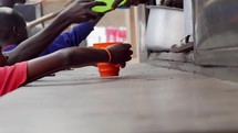 kids getting food in Uganda 