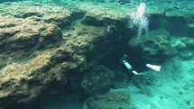 Divers entering cave in Florida spring system