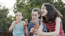Children eating Ice Cream together, enjoying and laughing