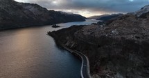 Drone footage of a road along Loch Lomond in Scotland.