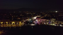 Split, Croatia after dark - bustling nightlife. Sideways aerial