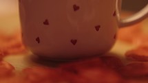 Valentine's Day themed coffee mug with hearts on it