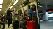 people on a subway train in Taiwan 
