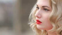 face of a model with red lipstick 