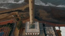 Maspalomas Lighthouse against ocean background, aerial