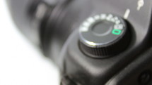 Setting mode dial lock button of the camera reflex - crane shot macro