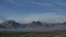 time-lapse of fog over a mountain range 