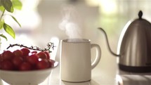 pouring hot water from a kettle 