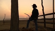 silhouette of a cowboy at sunset 