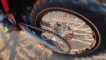 Motocross wheel walks on dirt road