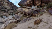 Ascending aerial of Indian rock art in a rugged canyon