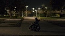 Lonely walk of a disabled kid in evening park