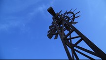 windmill against a blue sky