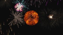 Dark sky full of Fourth of July Fireworks lights . Seamless loop visuals	