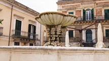 Ancient baroque fountain in Ragusa Ibla Sicily