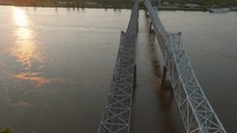 Drone Video of Sunset Over Bridge in Natchez Mississippi on the Mississippi River. High quality 4k footage