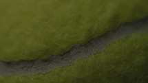 Dramatic, cinematic macro texture shots of a tennis ball