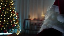 Santa Claus in the Christmas moody Atmosphere of a house 
