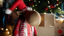 Christmas reindeer puppet dancing under the tree 