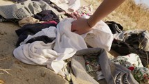 Textile Dump with used Clothes waste into the desert, fast fashion