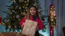 Young girl happy for received her Christmas gift box