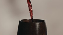 pouring wine into a chalice 