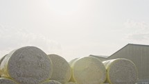 Large stacks of cotton bales at a cotton gin after harvest