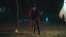 Mad Man with axe walk in the night halloween forest
