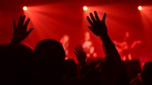 hands lifted during a worship service 