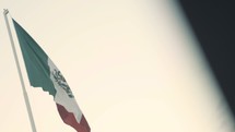 Mexican flag on a flagpole 