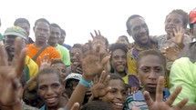 waving crowd in Papua New Guinea 