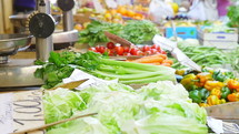 Various vegetables on a table at a farmer's market.