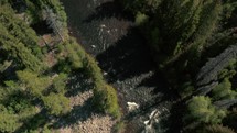 Aerial drone flying over a river in the Colorado Rocky Mountains.