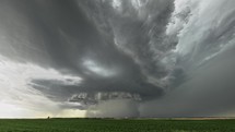 Supercell Tornado thunderstorm on green field 4k
