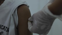 Asian Child Receiving Covid Vaccine