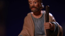 A figurine of Joseph the carpenter with the Holy Child.