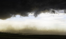 Dust Blowing Under Dark Storm Clouds