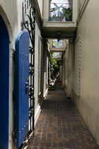 narrow brick alley between buildings 