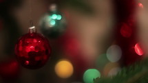 Christmas decoration ball toys rotating on blinking bokeh background.