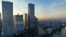 Bright Golden Sun Shining Through Buildings in London at Sunrise