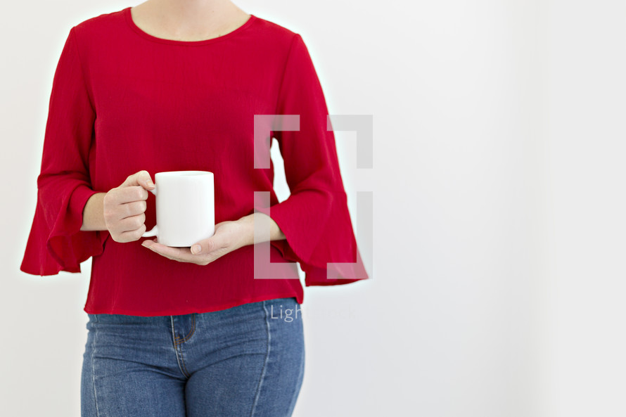woman holding a coffee mug 
