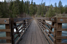 wooden bridge over a river 